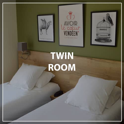 Chambre lits jumeaux hôtel